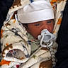 newborn, baby, infant, child, portrait, face, eyes, pacifier, hat, blanket, fleece, bundled, sleeping, cozy, indoors, close_up, baby_clothing, swaddled, cute, photography