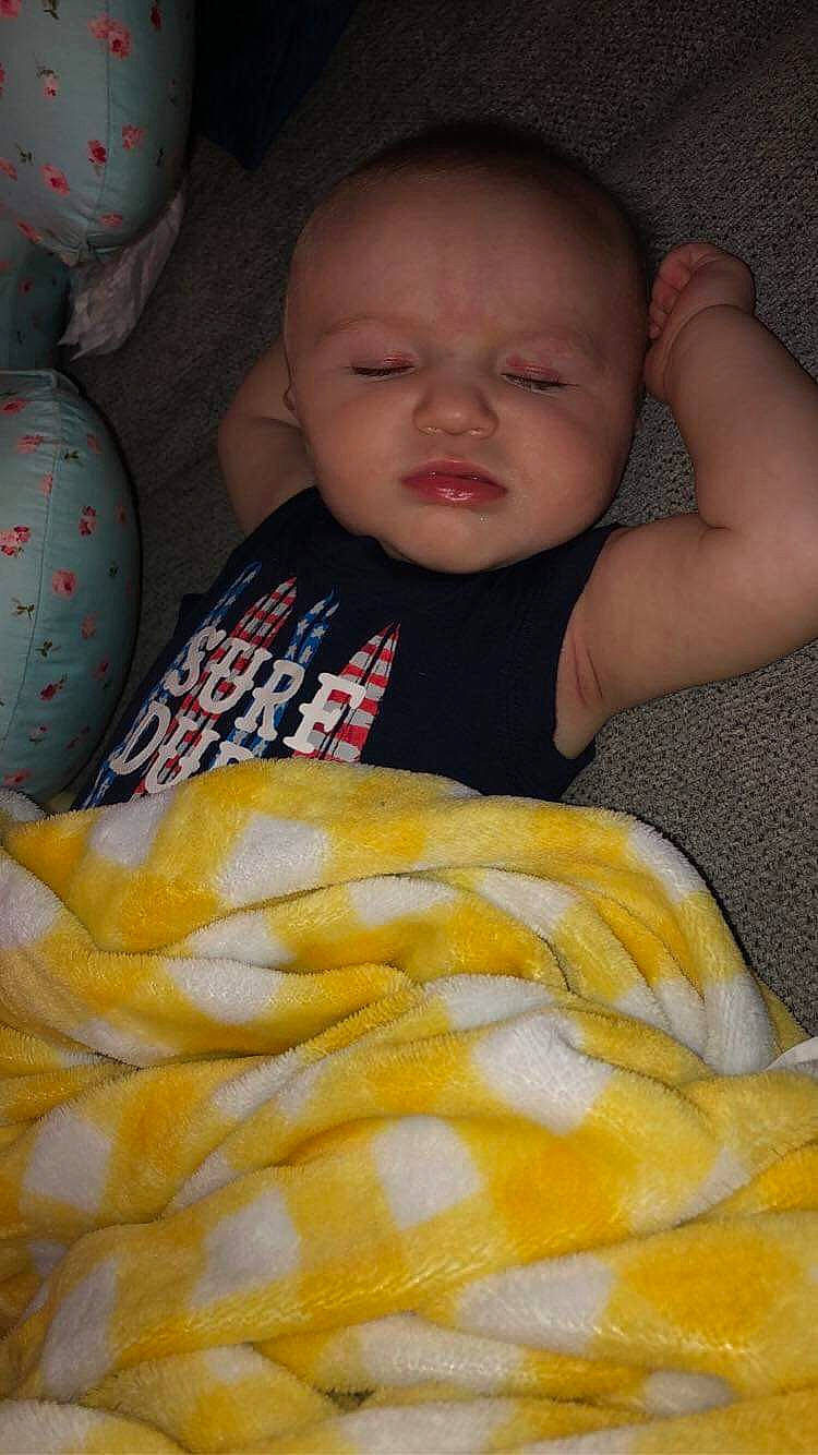 Gunnar is registered to the contest to win money with this photo: baby, baby_products, baby_toddler_clothing, cheek, child, close_up, comfort, eye, finger, iris, linens, mouth, orange, person, product, room, skin, textile, toddler, vertebrate