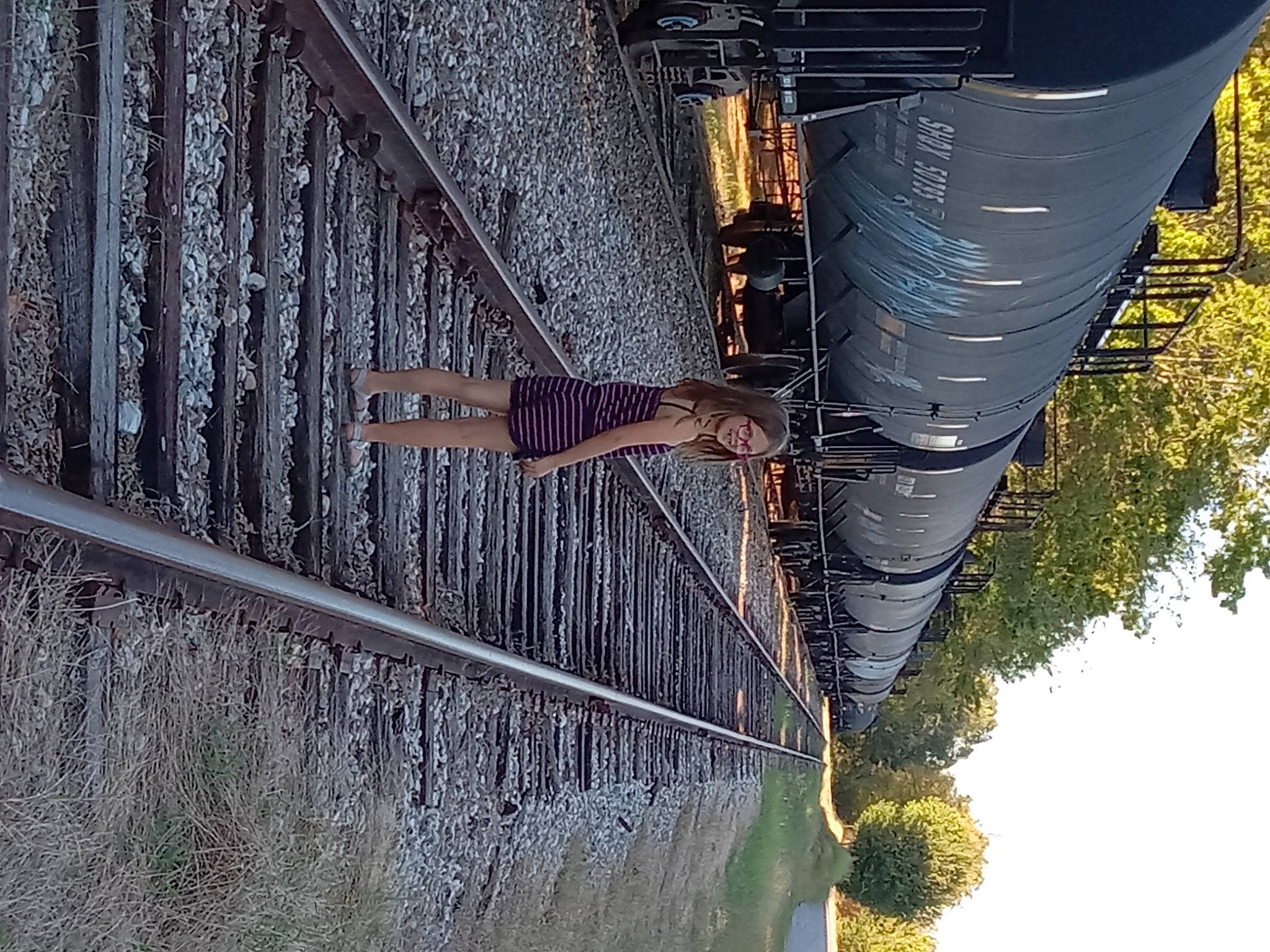 Dixie joined the competition — help win amazing prizes! bridge, city, denim, electricity, joy, line, metal, person, plant, public_utility, reflection, roof, rope, shadow, sky, steel, symmetry, tree, trunk, water