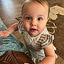 Evelynn is registered to the contest to win money with this photo: toddler, child, baby, face, eyes, curious, indoor, couch, hand, dress, striped, floor, carpet, furniture, person, skin, hair, home, young, innocent