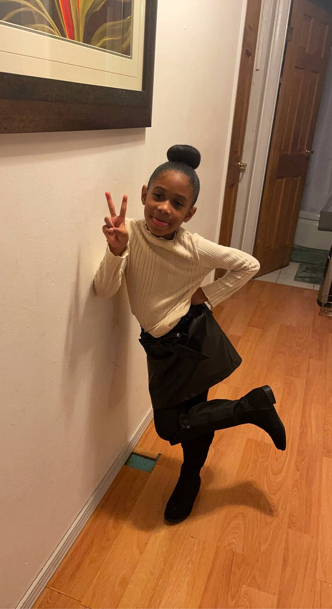 Alaysia is registered to the contest to win money with this photo: balance, door, elbow, event, fashion_design, floor, flooring, fun, gesture, hardwood, human_leg, joint, joy, knee, person, room, sleeve, sock, thigh, thumb