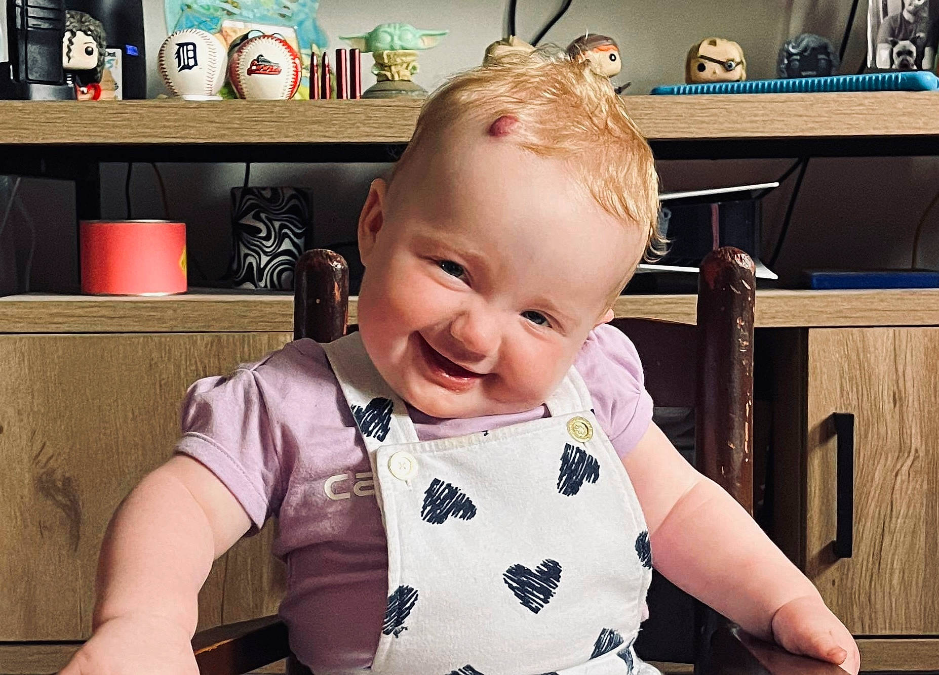 Faith is registered to the contest to win money with this photo: baby, baby_toddler_clothing, cabinetry, cheek, child, drawer, ear, eye, eyelash, fun, hairstyle, happy, iris, joy, person, product, shelf, sitting, skin, sleeve