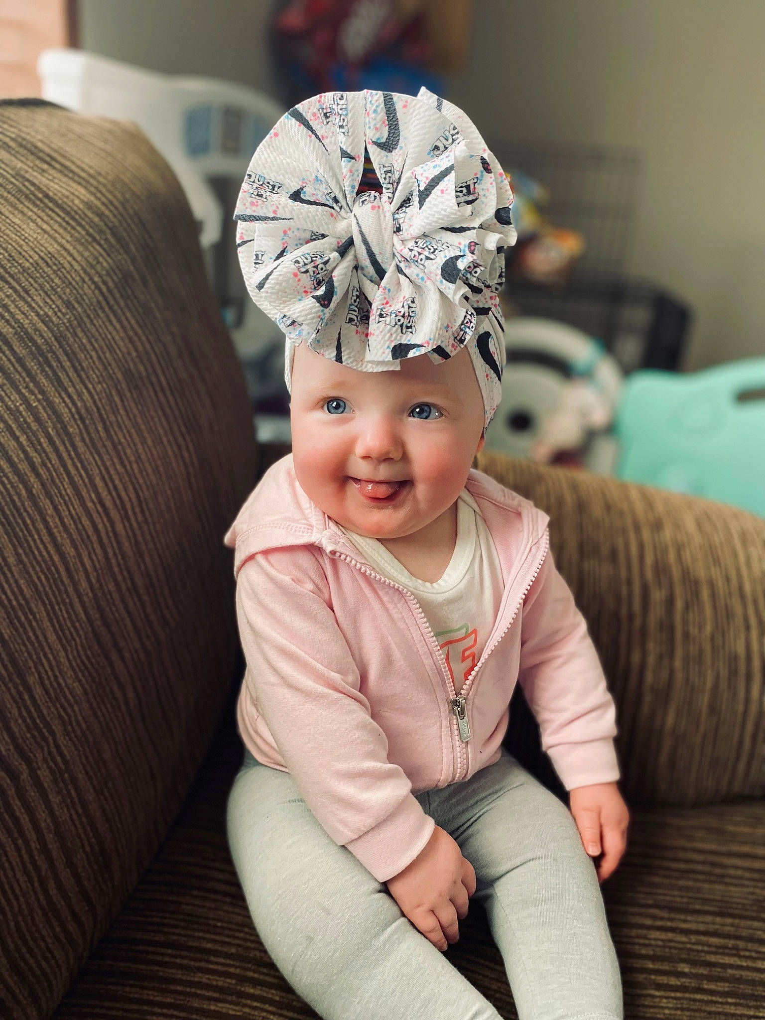 Faith is registered to the contest to win money with this photo: baby, baby_toddler_clothing, beanie, cap, child, comfort, costume_hat, eye, fashion_accessory, fun, hair_accessory, happy, hat, headband, headpiece, headwear, joy, magenta, person, personal_protective_equipment