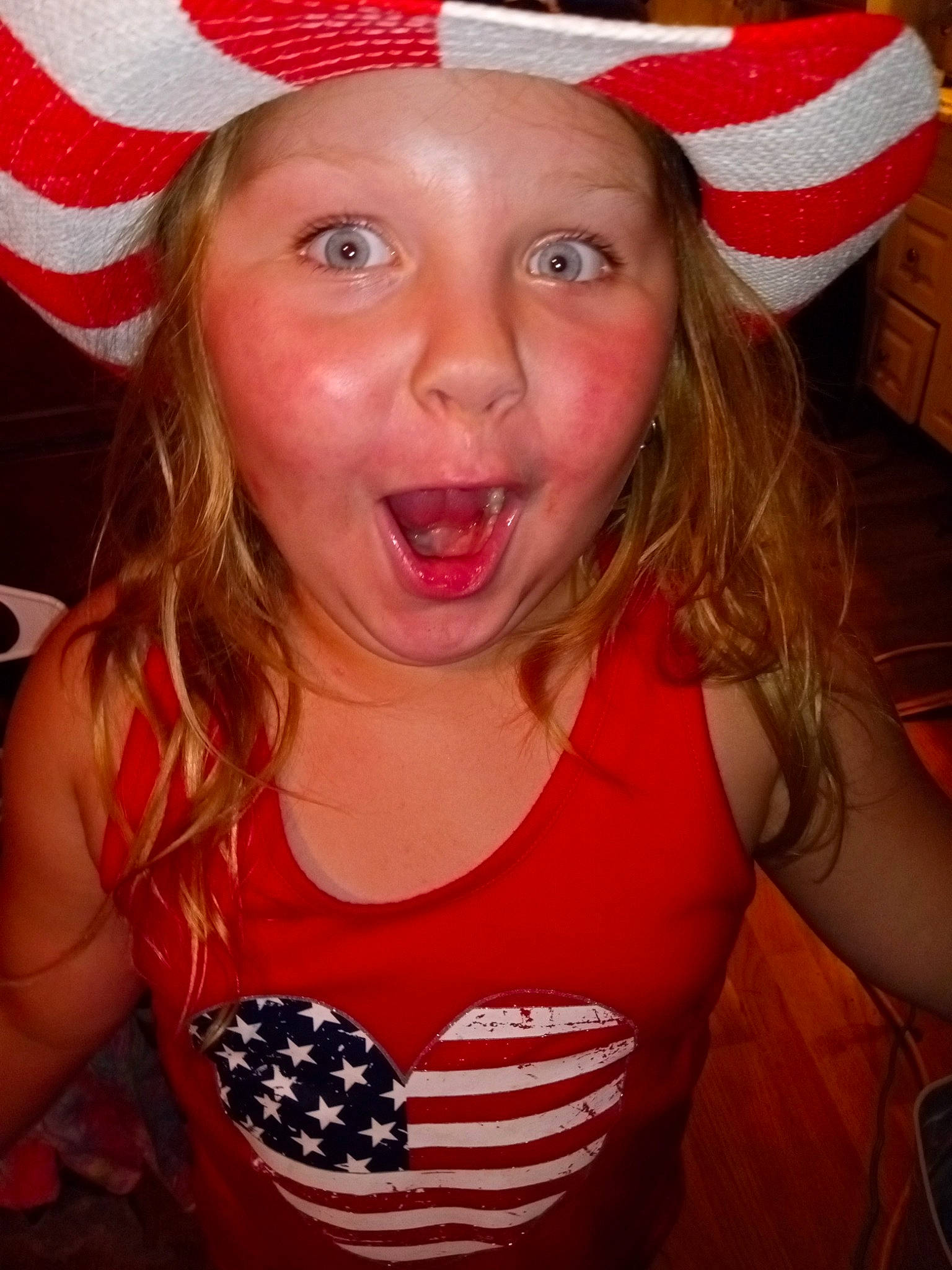 Madilyn is registered to the contest to win money with this photo: blond, cap, cheek, child, costume_hat, event, eyebrow, fun, happy, hat, headwear, jaw, lip, mouth, organ, person, sleeve, smile, sun_hat, surprise