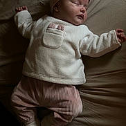 Kaylie participe au concours pour gagner de l'argent avec cette photo : baby, infant, sleeping, headband, bow, onesie, booties, pink_pants, white_top, bed, bed_sheet, soft_light, shadow, peaceful, portrait, newborn, closed_eyes, small_hands, indoors, fabric_texture