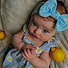 baby, big_eyes, blanket, blue_bow, child, closeup, clothing, cute, daisy_dress, fruit, hands, headband, infant, lemons, lying_down, newborn, portrait, props, skin, soft_texture