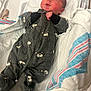 Robbie is registered to the contest to win money with this photo: architecture, baby, bed, blanket, building, clothing, coat, cradle, crib, face, furniture, head, hospital, infantbed, jacket, newborn, pants, person, photography, portrait