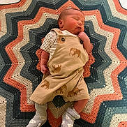Robbie joined the competition — help win amazing prizes! baby, blanket, clothing, couch, cushion, face, furniture, head, homedecor, hosiery, newborn, pants, person, photography, pillow, portrait, quilt, sleeping, sock, yawning