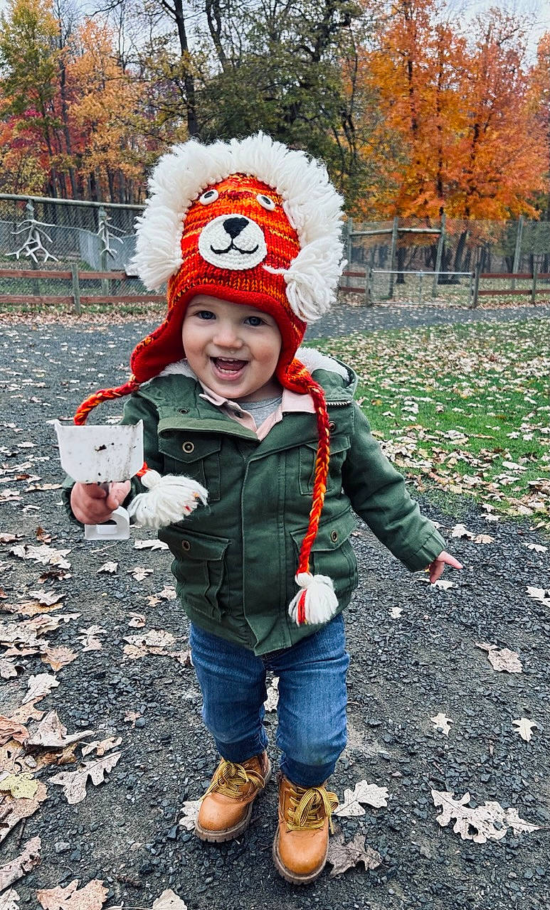 Axton joined the competition — help win amazing prizes! autumn, beanie, cap, child, costume, freezing, fun, fur, glove, grass, happy, headwear, jeans, joy, knit_cap, person, personal_protective_equipment, plant, recreation, smile