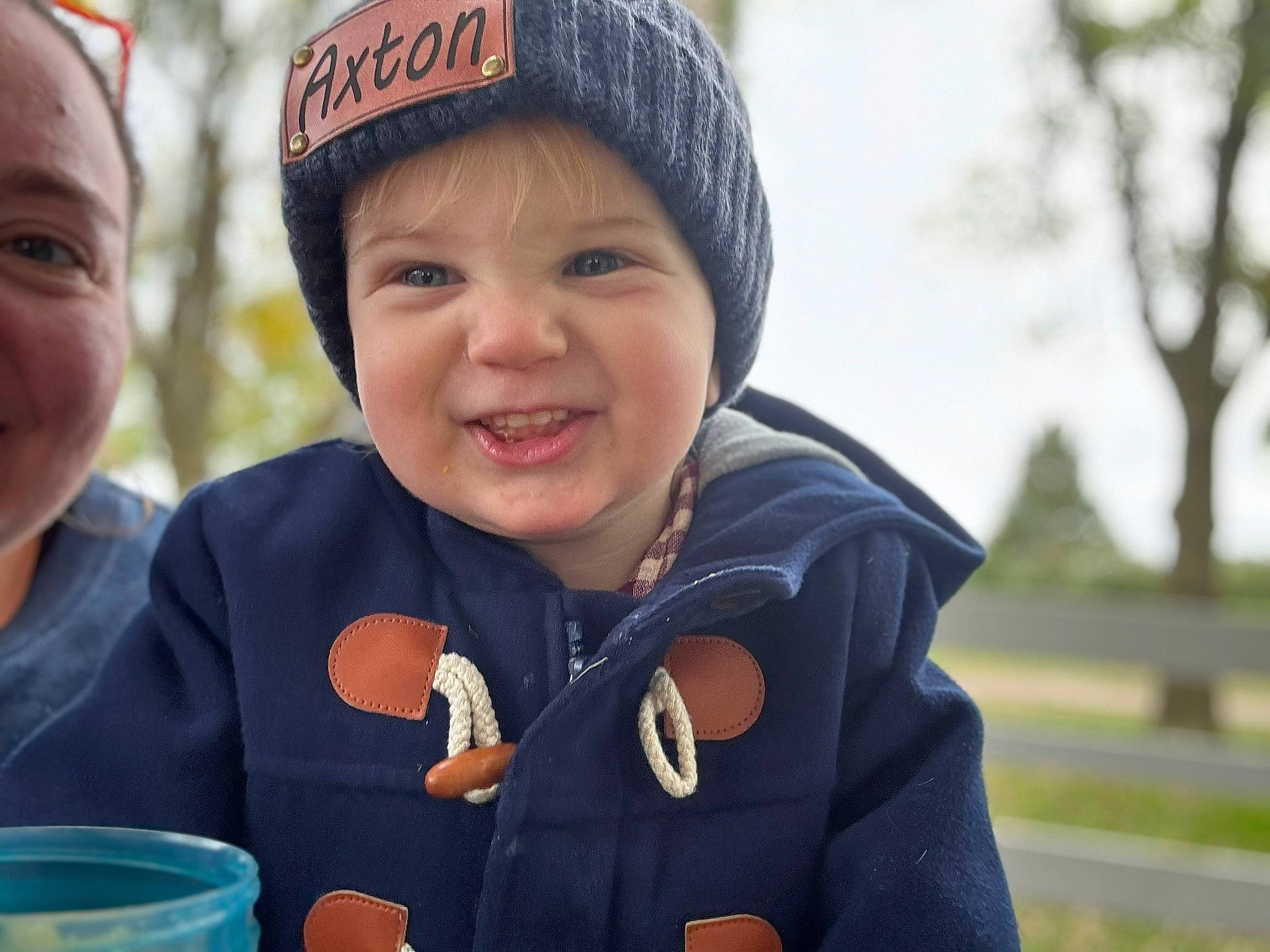 Axton joined the competition — help win amazing prizes! baby, beanie, cap, child, event, fun, grass, happy, headwear, jacket, joy, knit_cap, laugh, leisure, outerwear, person, recreation, smile, toddler, travel