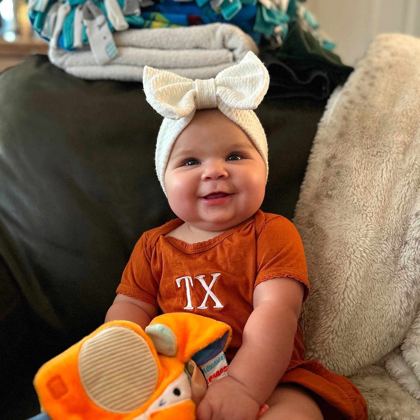 Brooklyn joined the competition — help win amazing prizes! architecture, baby, cap, clothing, costume, couch, cushion, face, furniture, happy, hat, head, homedecor, person, photography, portrait, sitting, smile, t_shirt, toy