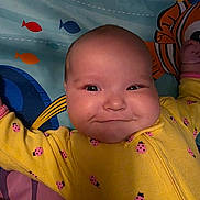 Elaina joined the competition — help win amazing prizes! baby, infant, smile, yellow_clothing, ladybug_pattern, face, cheeks, play_mat, fish_pattern, colorful, lying_down, arms_outstretched, child, cute, indoors, happy, portrait, skin, head, expression