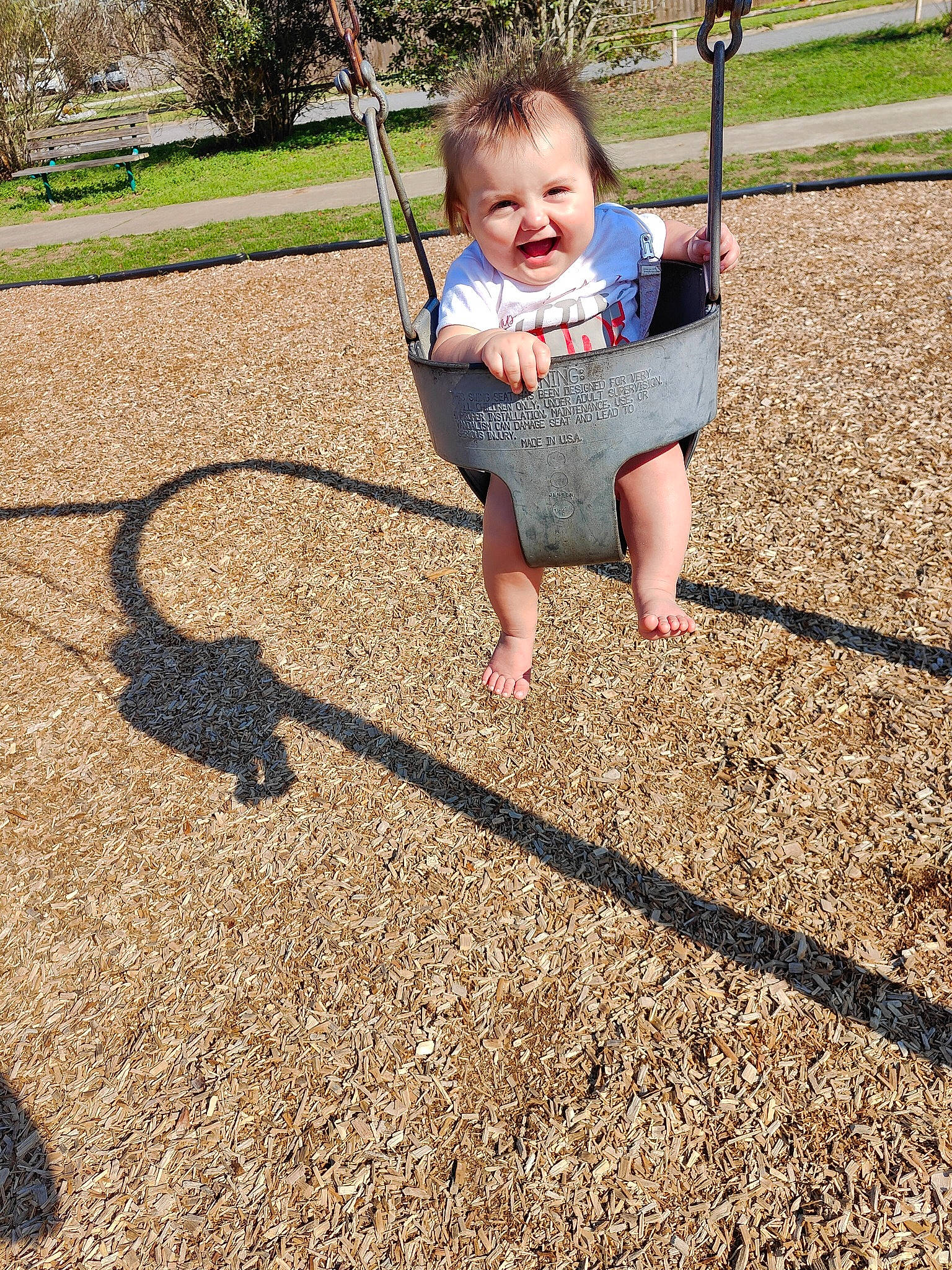 Sequoyah joined the competition — help win amazing prizes! baby, baby_toddler_clothing, barefoot, child, city, fun, grass, happy, leisure, outdoor_play_equipment, people_in_nature, person, plant, play, playground, shadow, smile, soil, swing, toddler