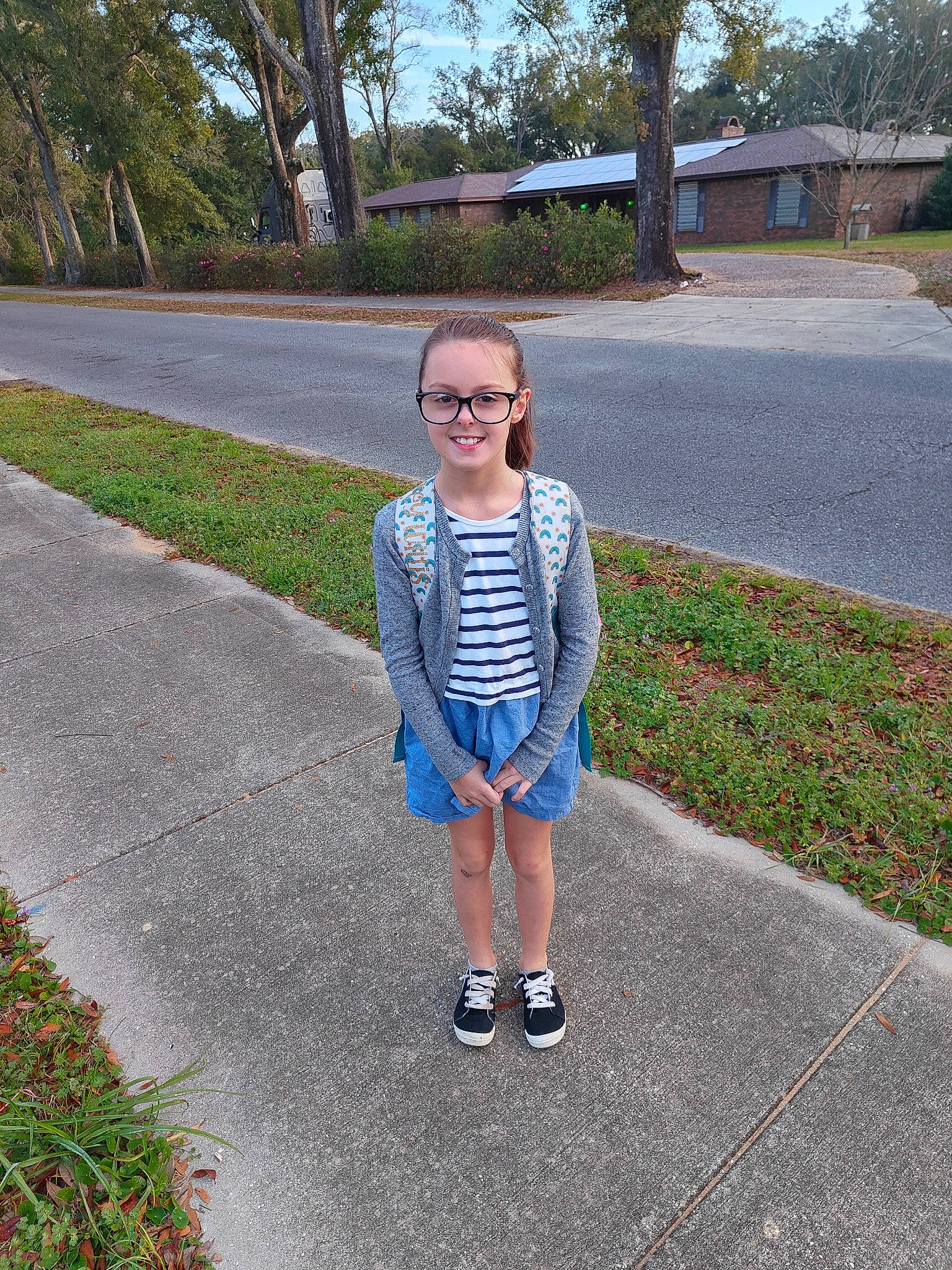 Aubrey is registered to the contest to win money with this photo: asphalt, denim, electric_blue, eyewear, fun, grass, joy, leaf, leisure, pattern, people_in_nature, person, plant, recreation, road, road_surface, sidewalk, sky, spring, sunglasses