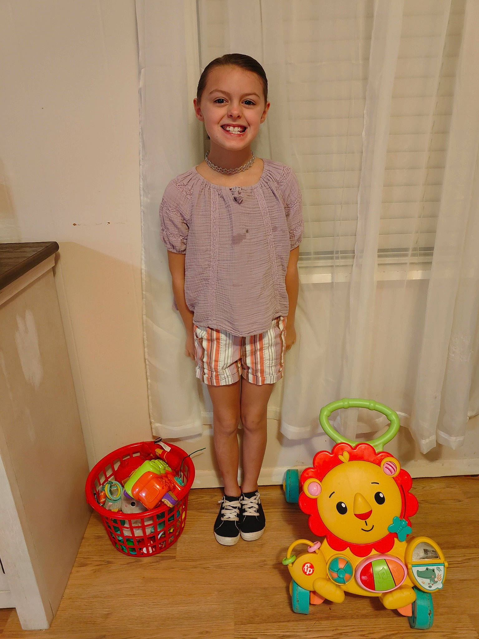 Aubrey joined the competition — help win amazing prizes! baby_toddler_clothing, child, floor, flooring, fun, happy, human_leg, joy, knee, orange, pattern, person, pink, room, shorts, sleeve, smile, stuffed_toy, textile, thigh