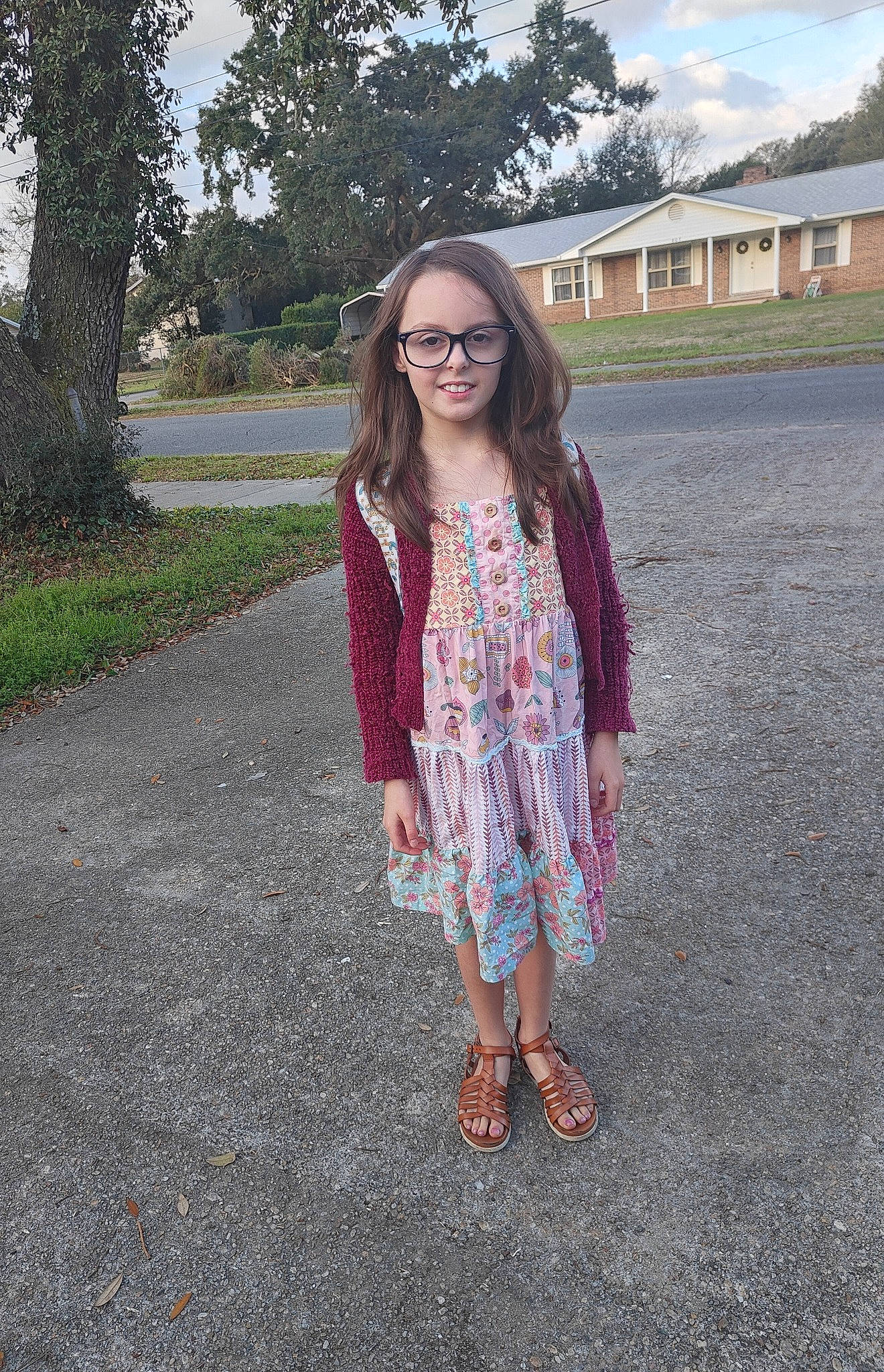 Aubrey is registered to the contest to win money with this photo: asphalt, dress, electric_blue, eyewear, fashion_design, fawn, grass, joy, long_hair, pattern, person, plaid, plant, road_surface, sky, sleeve, smile, sunglasses, tartan, tree