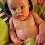 Jameson joined the competition — help win amazing prizes! baby, infant, child, diaper, seat, face, skin, hand, arm, chubby, curious, expression, indoor, closeup, portrait, human, cute, sitting, colorful, soft_lighting