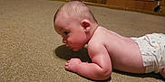 Jameson joined the competition — help win amazing prizes! arm, baby, carpet, casual, child, crawling, curious, diaper, face, floor, head, home, indoors, infant, person, room, side_view, skin, wood_paneling, young