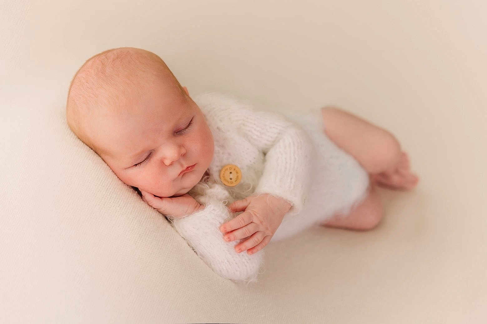 Theo is registered to the contest to win money with this photo: baby, child, closeup, cozy, cute, face, hand, head, indoors, infant, newborn, peace, peaceful, portrait, rest, skin, sleep, sleeping, soft_texture, white_knitwear
