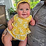 Rosemary joined the competition — help win amazing prizes! baby, child, infant, yellow_dress, headband, smile, blue_eyes, chubby_cheeks, adult, holding, portrait, outdoor, blurred_background, greenery, cute, happy, clothing, person, skin, face