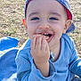 baby, blanket, blue_cap, casual_clothing, child, cute, daylight, food, fun, grass, happy, nature, outdoor, playful, portrait, sitting, smiling, snack, toddler, young_child