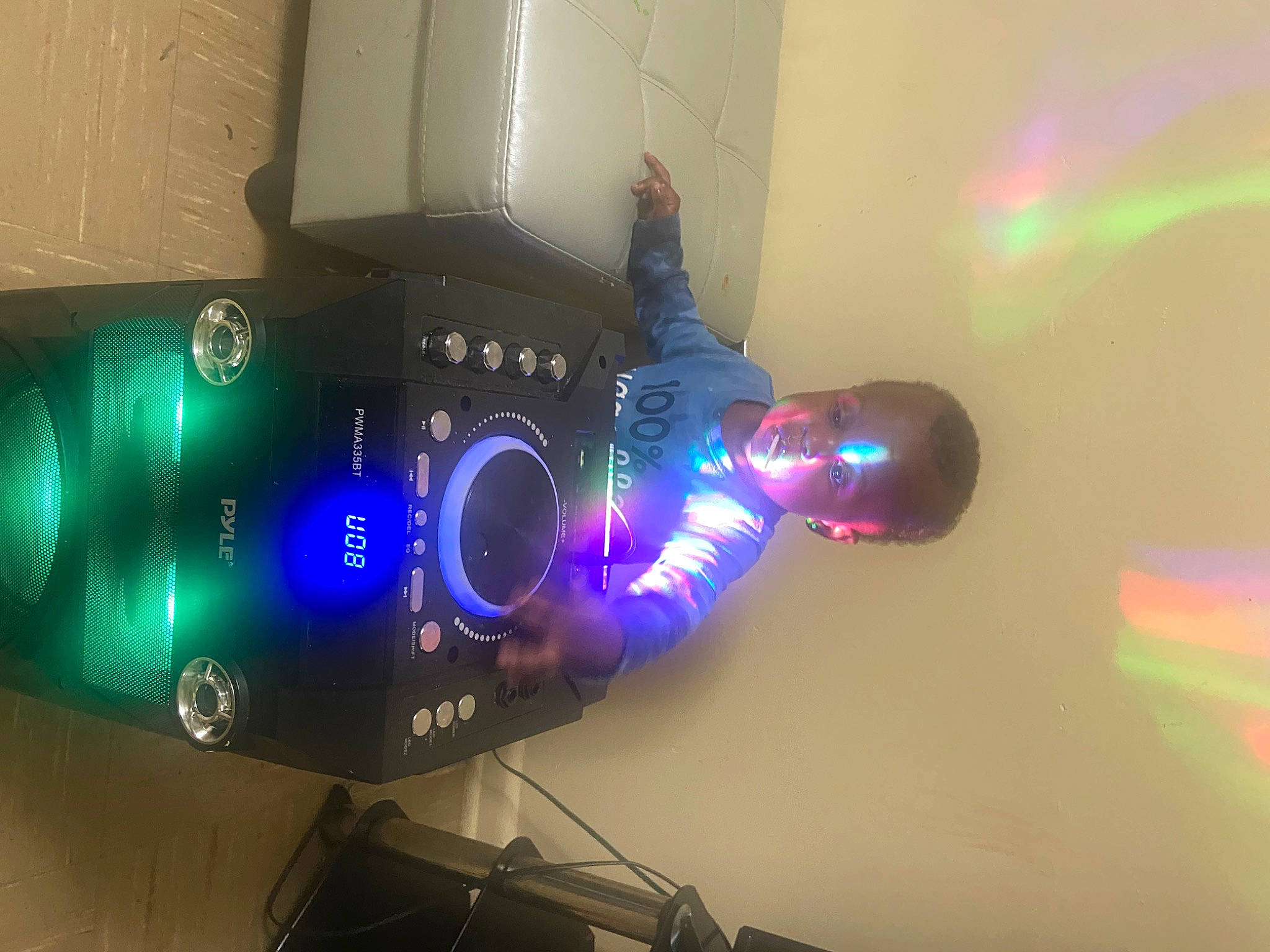 Tristian is registered to the contest to win money with this photo: audio_equipment, automotive_lighting, display_device, electric_blue, electronic_instrument, entertainment, event, gadget, gas, home_appliance, machine, magenta, mobile_phone, neon, person, plastic_bottle, purple, room, space, video_projector