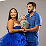 Keyvan participe au concours pour gagner de l'argent avec cette photo : family, woman, man, baby, newborn, portrait, studio, dress, blue, clothing, smile, holding, cute, people, parent, child, happy, love, indoors, blanket
