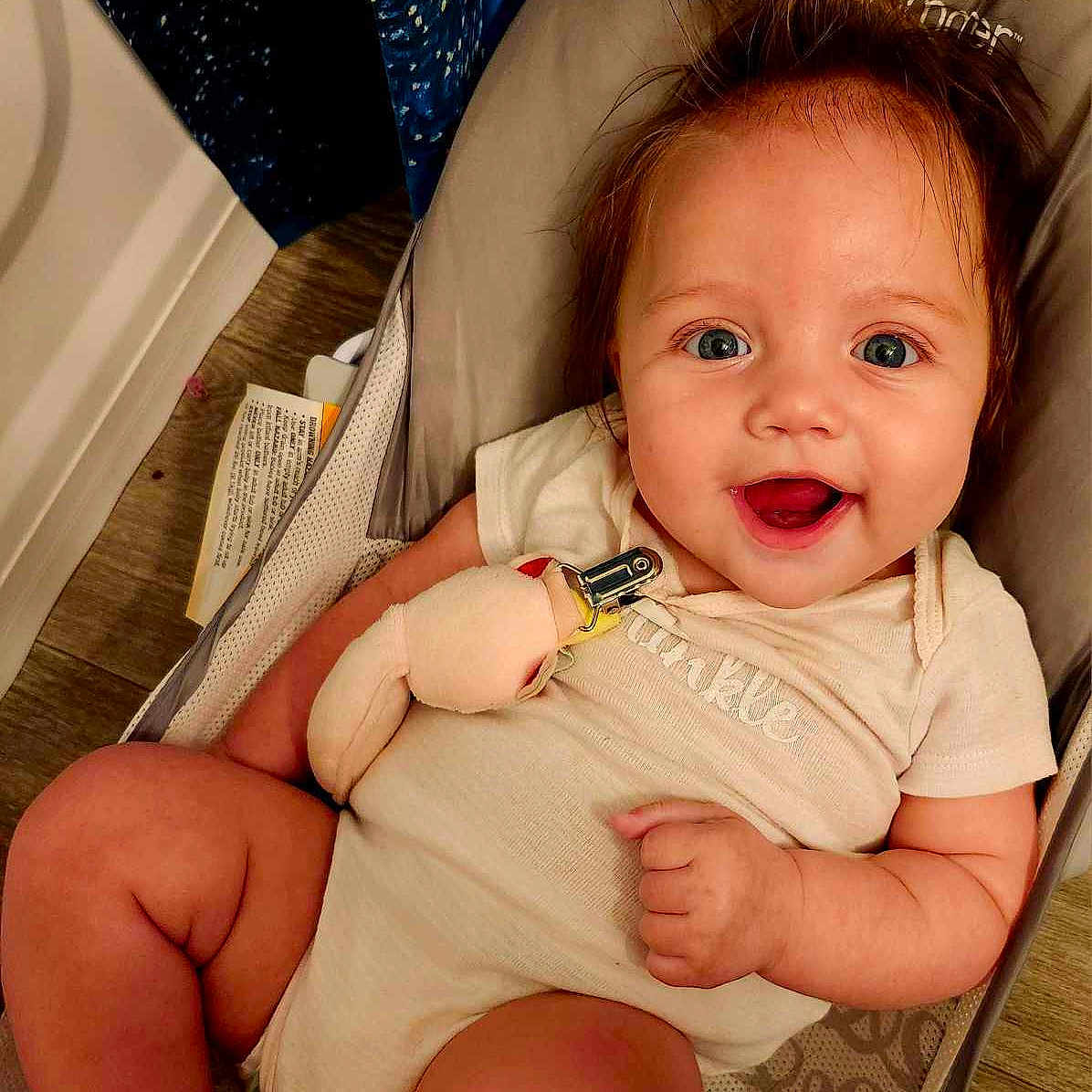 Presley is registered to the contest to win money with this photo: accessories, baby, babylaughing, bodypart, clothing, cushion, face, finger, furniture, happy, head, homedecor, jewelry, laughing, necklace, person, photography, portrait, smile, t_shirt