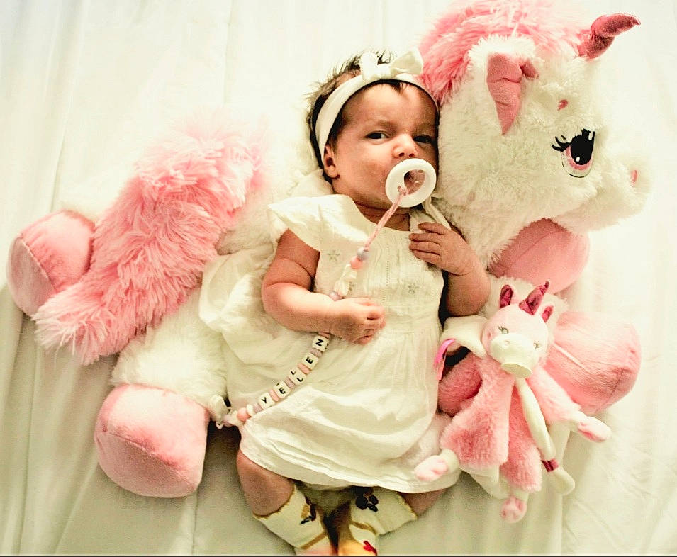 Yelena participe au concours pour gagner de l'argent avec cette photo : baby, baby_toddler_clothing, clothing, costume_hat, dress, ear, face, fashion_accessory, fur, hair_accessory, happy, headband, headgear, headpiece, magenta, pattern, person, pink, sleeve, textile