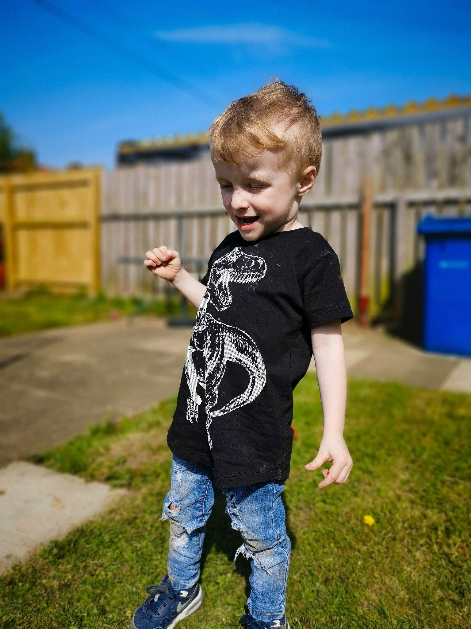 Oscar is registered to the contest to win money with this photo: blue, child, child_model, cool, footwear, fun, grass, happy, jeans, joy, male, person, photography, play, shoe, sky, sleeve, standing, summer, t_shirt