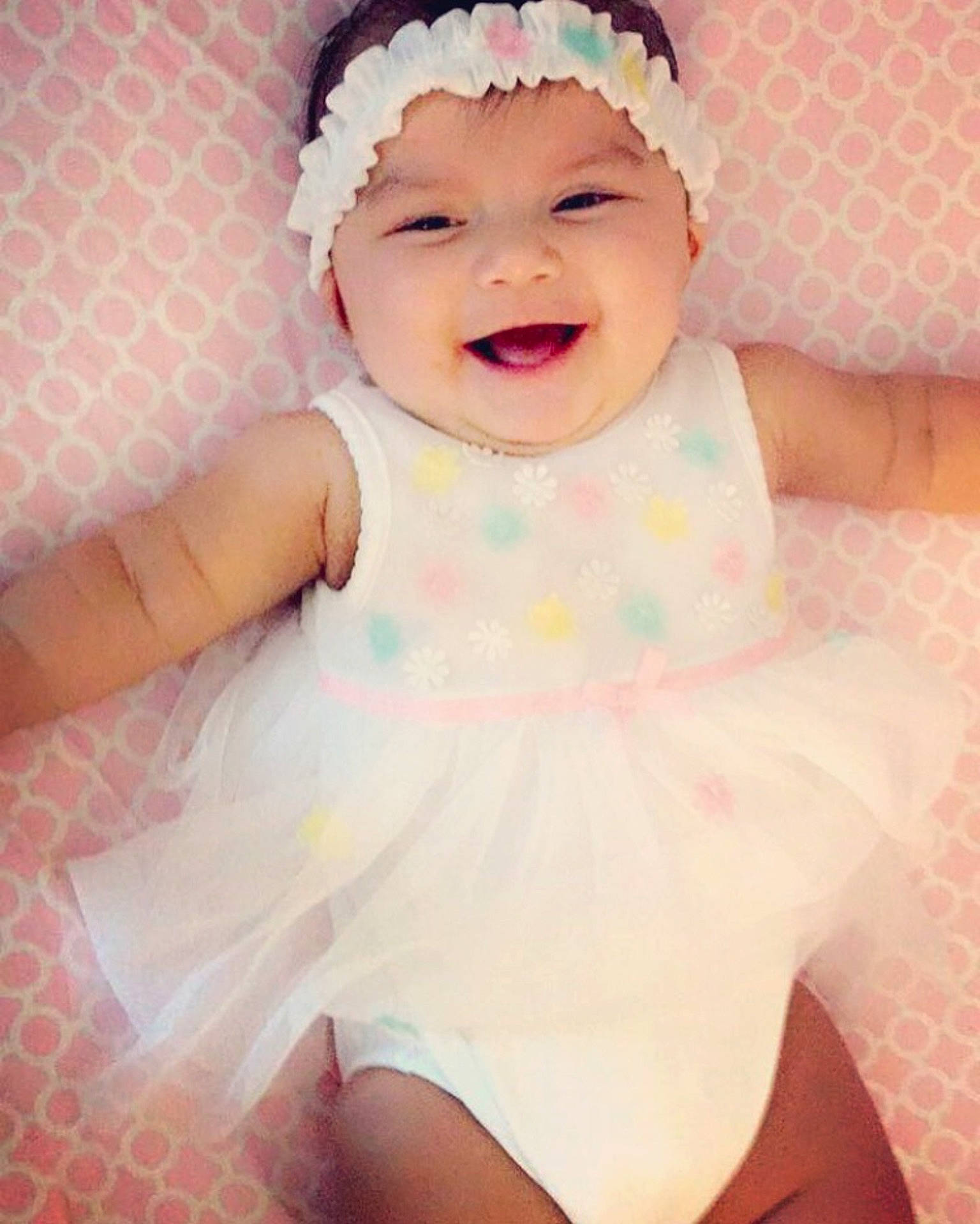 Jolie is registered to the contest to win money with this photo: cheek, child, girl, hair_accessory, headband, headgear, headwear, infant, material, person, pink, product, smile, textile, toddler