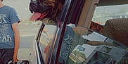 Juicebox joined the competition — help win amazing prizes! dog, car, window, gas_station, person, reflection, animal, outdoor, pet, tongue, happy, vehicle, filling_gas, summer, daytime, brindle, muzzle, seat, shirt, hand