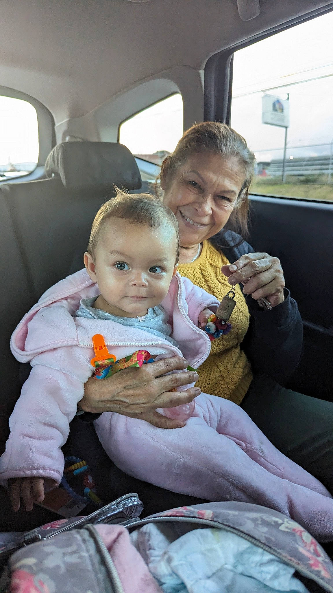 Alanna is registered to the contest to win money with this photo: auto_part, baby, baby_toddler_clothing, car, car_seat, child, comfort, family_car, fun, happy, joy, lap, luxury_vehicle, motor_vehicle, person, sitting, skin, smile, toddler, travel