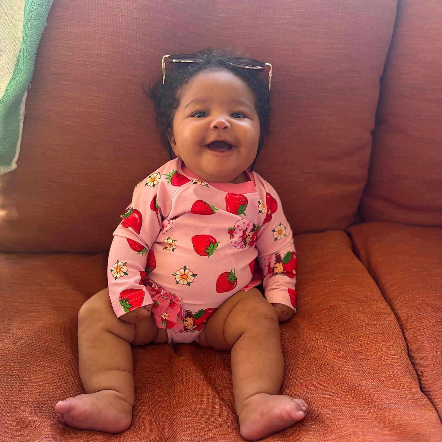 Amirakle is registered to the contest to win money with this photo: accessories, baby, babylaughing, bodypart, chair, couch, cushion, face, finger, furniture, glasses, hand, happy, head, homedecor, person, photography, portrait, sitting, smile