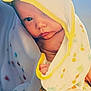 Huntson joined the competition — help win amazing prizes! baby, child, infant, towel, hooded_towel, soft_texture, cute, curious, wrapped, colorful, yellow_trim, patterned_fabric, skin, face, hand, indoors, closeup, portrait, comfort, warmth