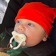 Huntson joined the competition — help win amazing prizes! baby, infant, pacifier, orange_hat, blanket, car_seat, child, face, blue_eyes, warm_clothing, safety_harness, closeup, indoors, soft_texture, cute, wearing_hat, portrait, young_child, baby_boy, cozy