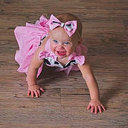 Dallas Grace joined the competition — help win amazing prizes! baby, child, crawling, pink_dress, bow, headband, blue_eyes, happy, floor, wood_floor, indoors, person, cute, smiling, toddler, skin, arms, fingers, clothing, portrait