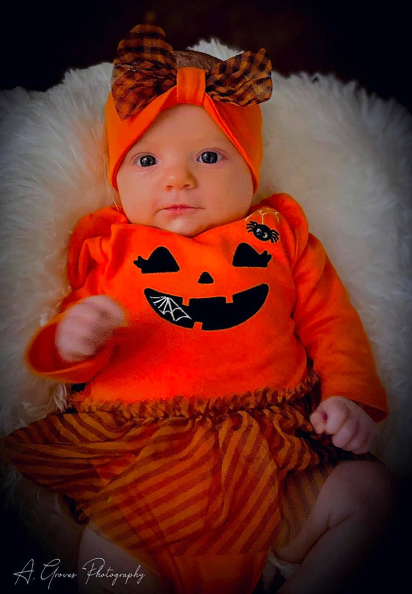 Everly Mae joined the competition — help win amazing prizes! baby, baby_toddler_clothing, calabaza, costume, costume_accessory, costume_hat, fictional_character, fur, happy, hat, headwear, human_body, orange, outerwear, peach, person, personal_protective_equipment, pink, pumpkin, toddler