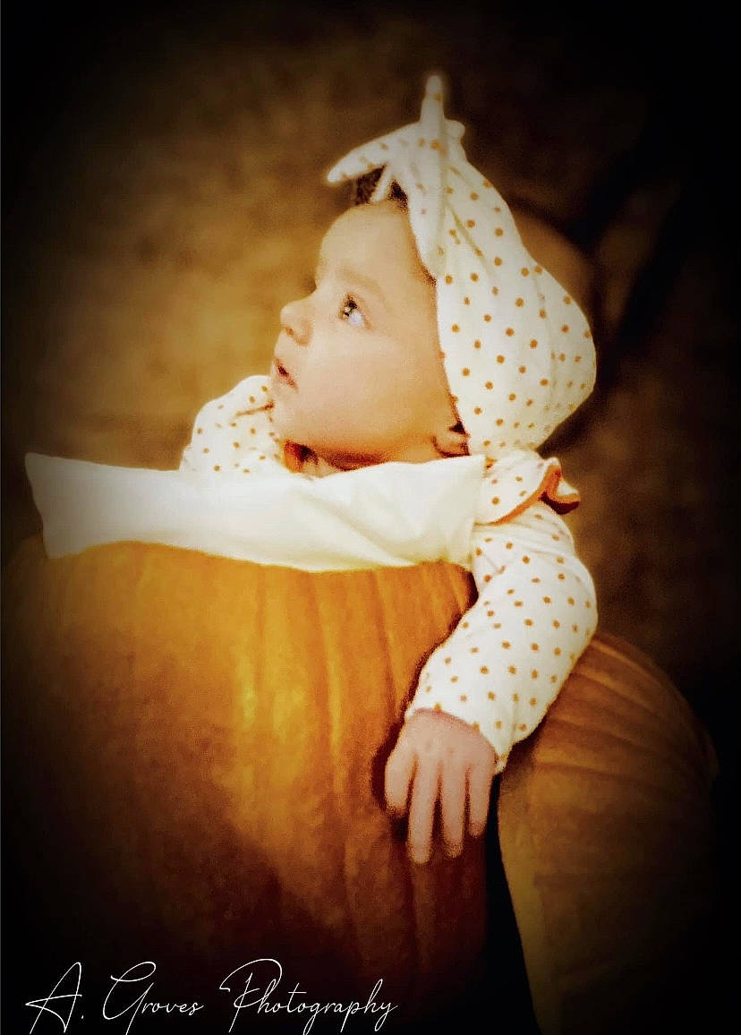 Everly Mae joined the competition — help win amazing prizes! baby, baby_products, baby_toddler_clothing, beanie, cap, child, comfort, darkness, fashion_accessory, flash_photography, grass, happy, headwear, pattern, person, portrait, portrait_photography, room, sitting, sleeve