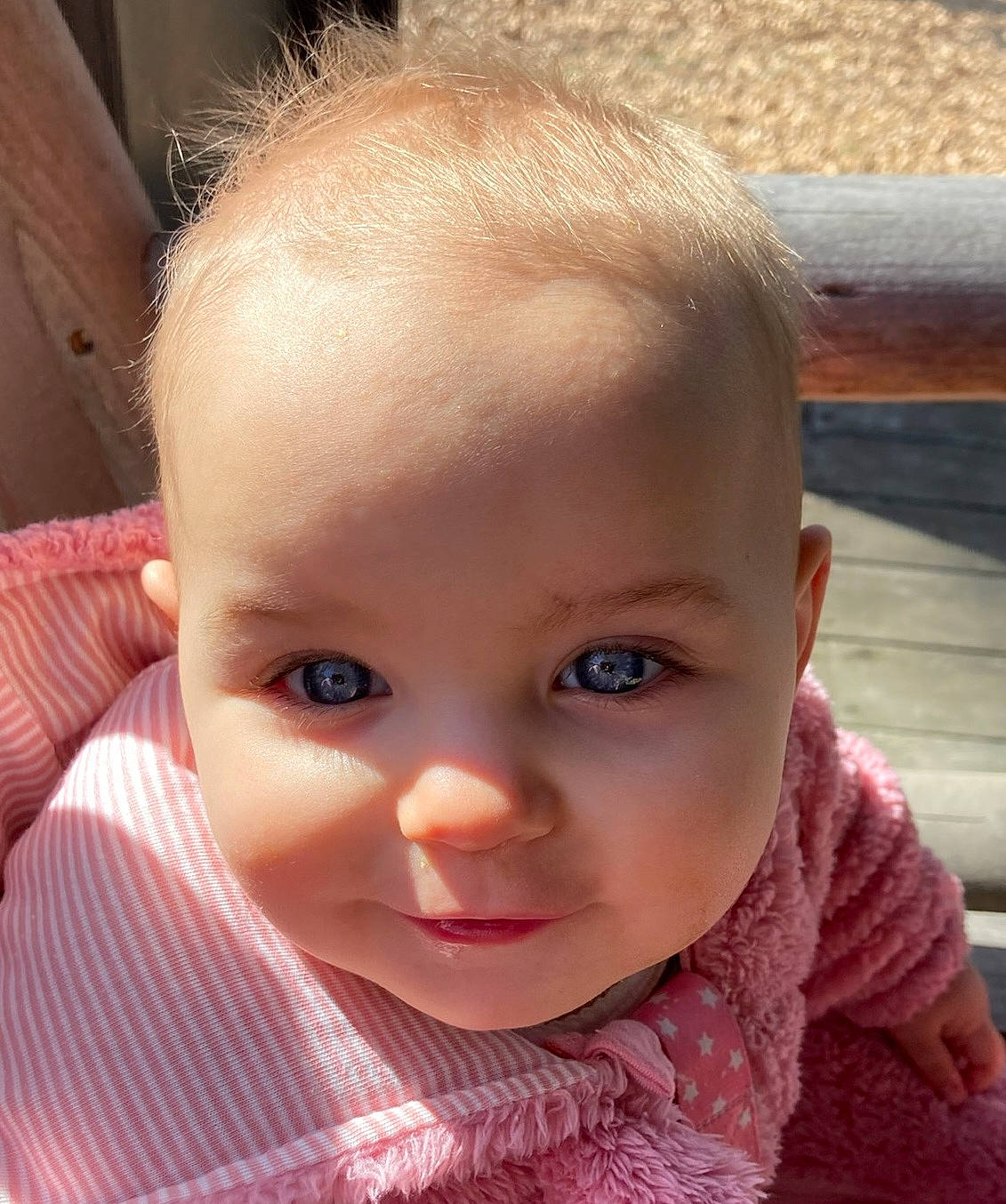 Willow joined the competition — help win amazing prizes! baby, baby_toddler_clothing, cheek, child, chin, ear, eyebrow, eyelash, grass, happy, iris, lip, mouth, nose, person, pink, sitting, skin, sleeve, toddler