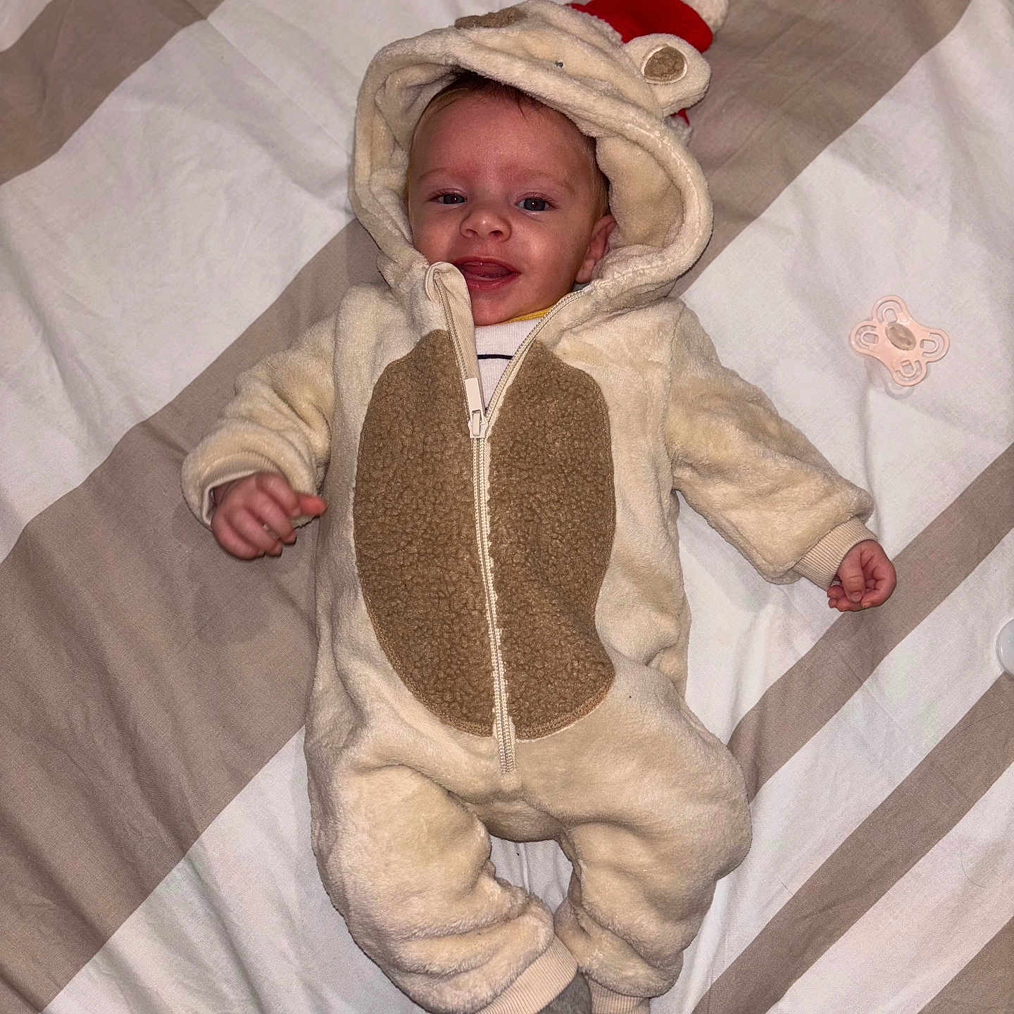 Ayden participe au concours pour gagner de l'argent avec cette photo : baby, blanket, bonnet, clothing, coat, face, furniture, happy, hat, head, hood, hoodie, jacket, knitwear, person, photography, portrait, smile, sweater, sweatshirt