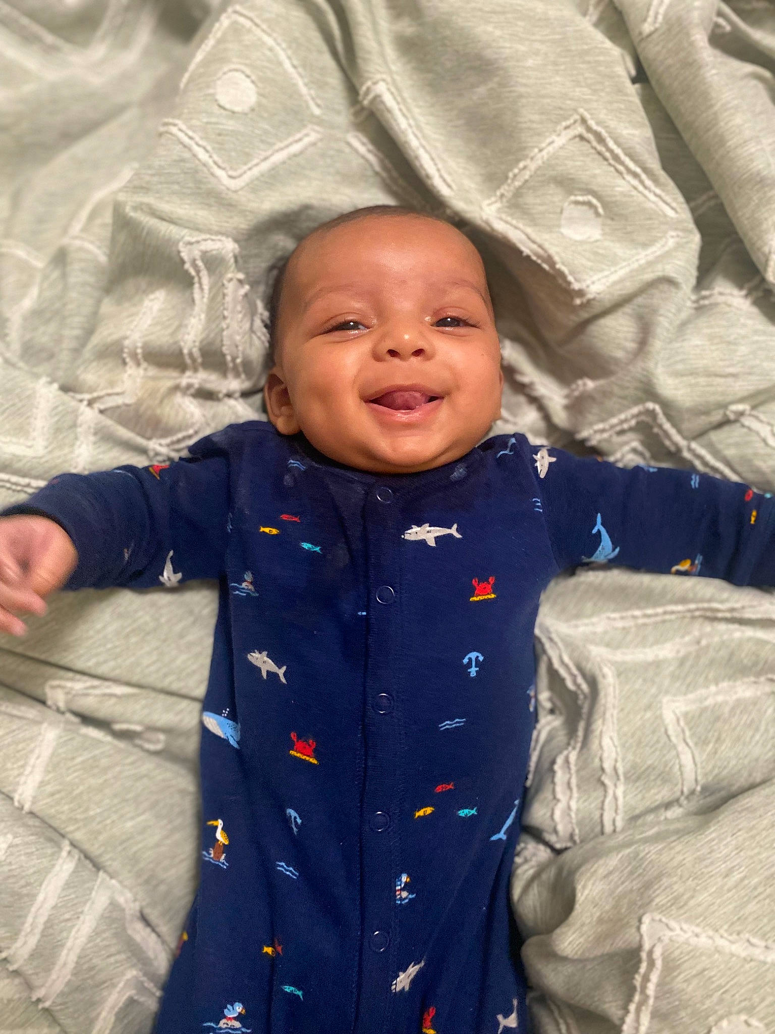 Emerson joined the competition — help win amazing prizes! baby, baby_toddler_clothing, child, comfort, electric_blue, facial_expression, fun, gesture, happy, human_body, jacket, linens, outerwear, person, product, sitting, skin, sleeve, smile, textile