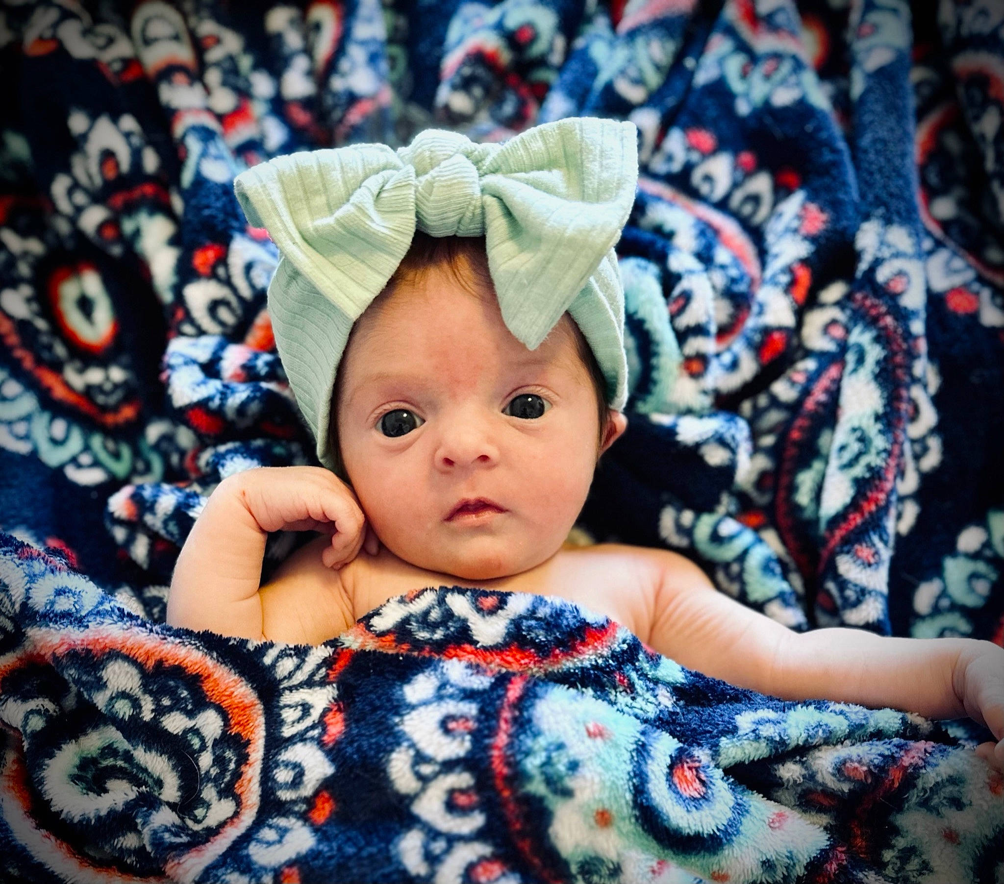 Rowyn is registered to the contest to win money with this photo: baby, baby_products, baby_sleeping, baby_toddler_clothing, beanie, bedding, cap, child, costume_hat, eye, fashion_accessory, hair_accessory, happy, head, knit_cap, linens, pattern, person, sleeve, textile