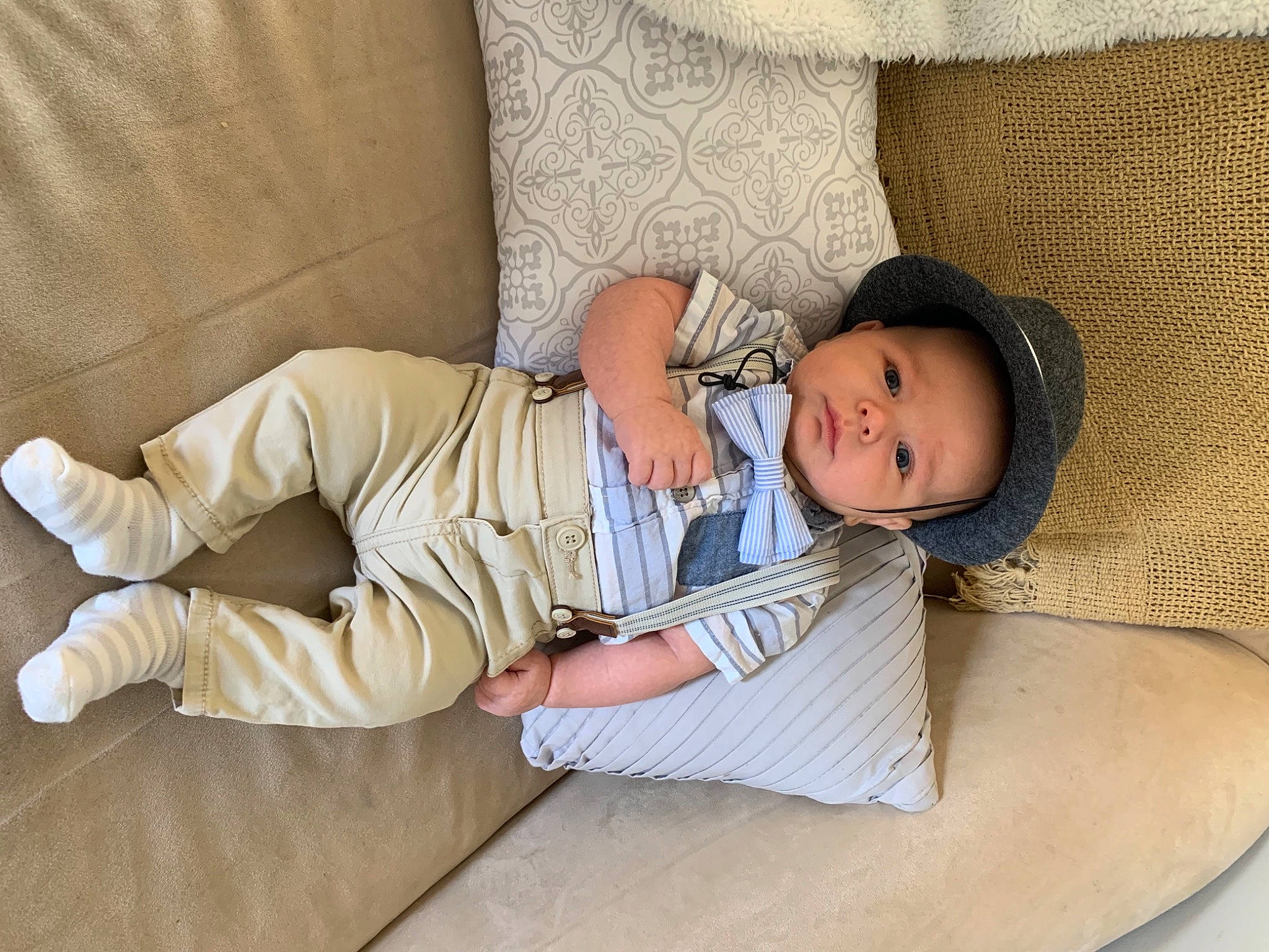 Gunnar is registered to the contest to win money with this photo: baby, baby_toddler_clothing, child, comfort, couch, flooring, foot, headwear, linens, nap, person, room, sitting, skin, sleep, sleeve, smile, t_shirt, textile, throw_pillow