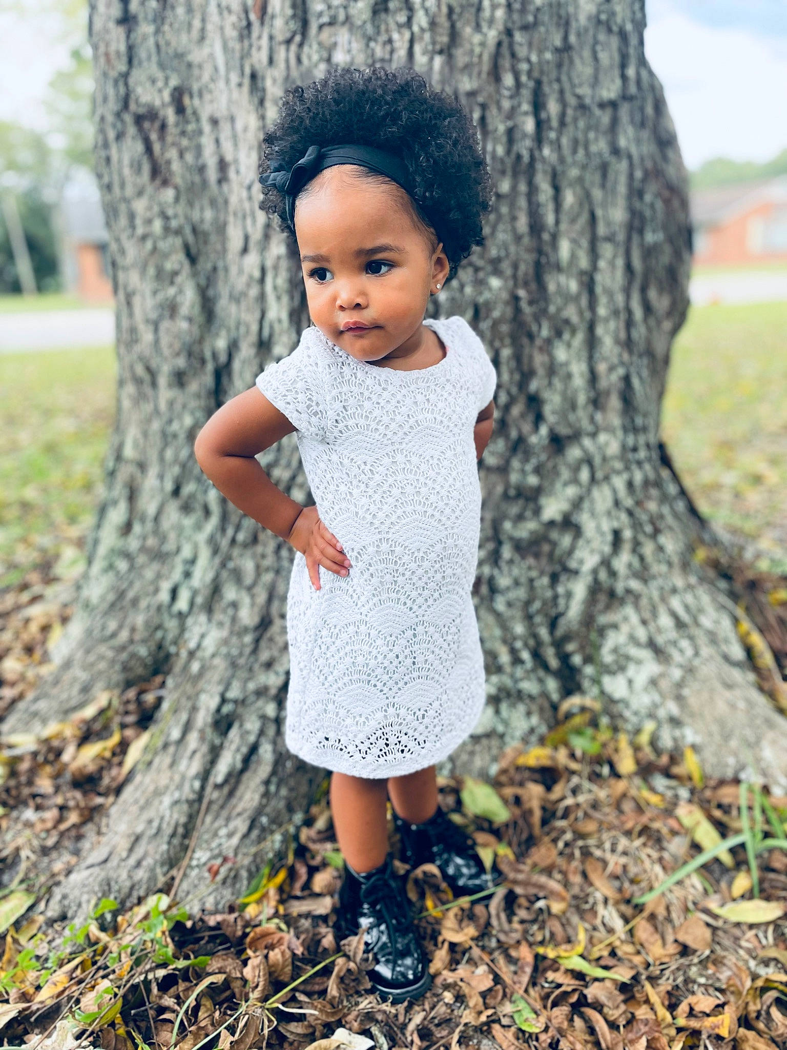 Kenzie is registered to the contest to win money with this photo: botany, branch, face, forest, grass, hair, hairstyle, happy, head, leaf, nature, people_in_nature, person, plant, toddler, tree, trunk, twig, wood, woodland