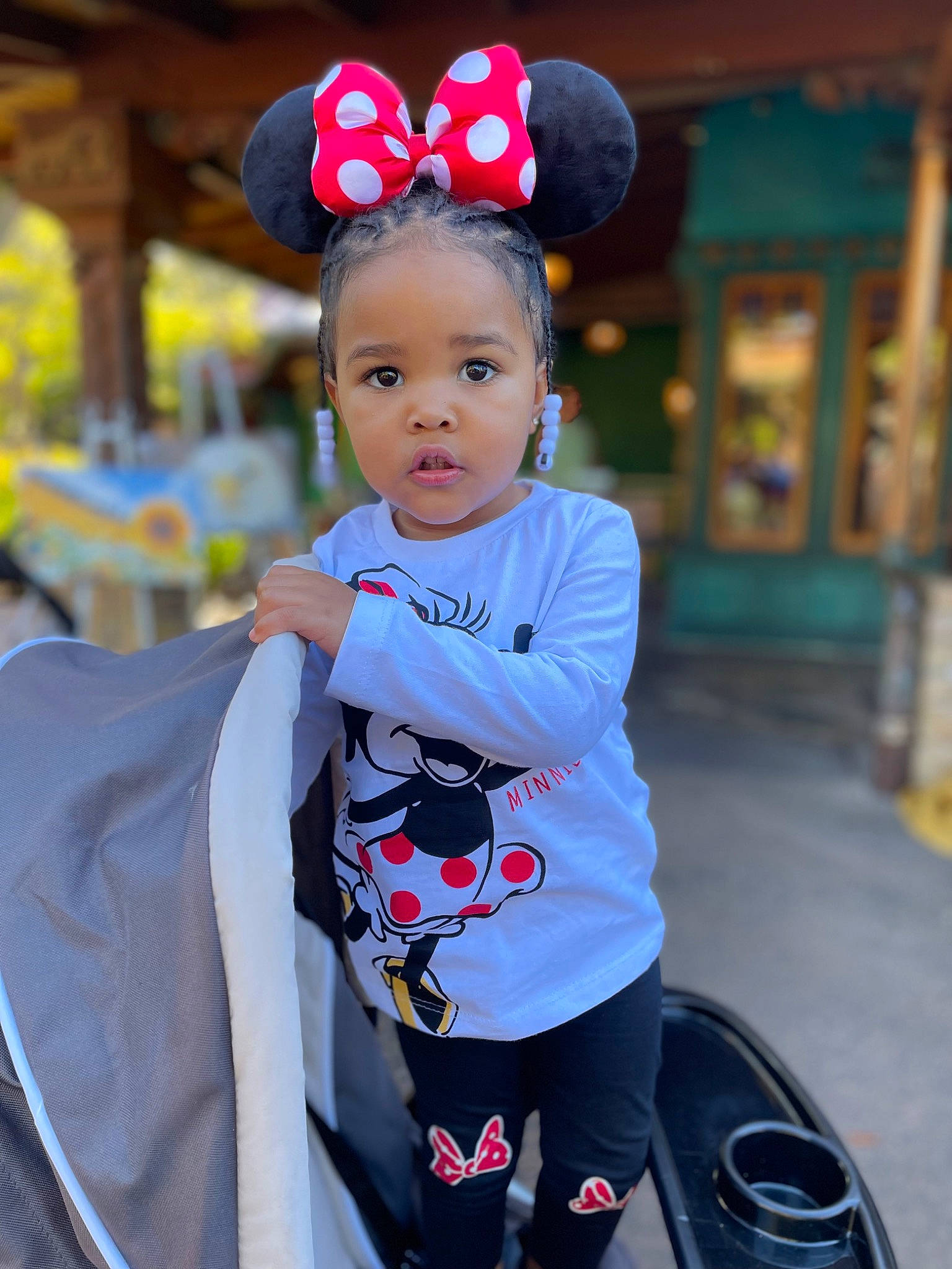 Kenzie joined the competition — help win amazing prizes! baby, baby_toddler_clothing, child, costume_hat, event, fashion_accessory, fun, happy, human_body, leisure, motor_vehicle, outerwear, person, personal_protective_equipment, recreation, sleeve, street_fashion, t_shirt, toddler, travel