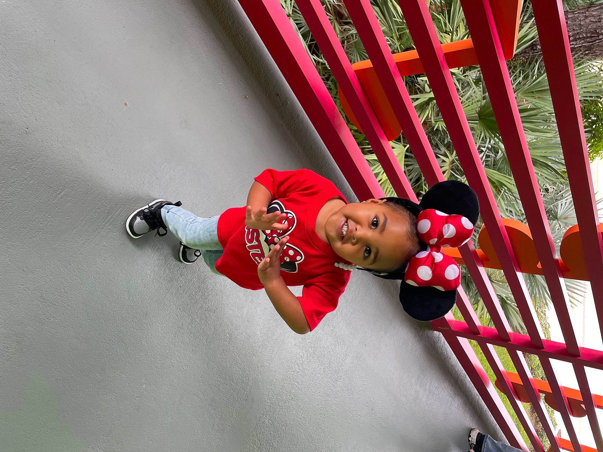 Kenzie is registered to the contest to win money with this photo: carmine, child, chute, elbow, fun, handrail, hat, human_body, joy, leisure, magenta, outdoor_play_equipment, person, plant, recreation, red, shorts, smile, stairs, thigh