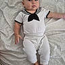 Noah joined the competition — help win amazing prizes! arm, baby, bed, bedding, blanket, child, curious_expression, cute, foot, human, indoors, infant, lying_down, person, portrait, sailor_outfit, soft_lighting, texture, white_clothing, young
