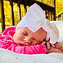 Ellie joined the competition — help win amazing prizes! baby, sleeping, white_bow, pink_clothing, blanket, porch, wooden_railing, autumn_leaves, outdoor, closeup, face, hand, infant, cozy, soft_texture, natural_light, peaceful, portrait, child, relaxation