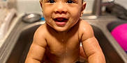 Salux is registered to the contest to win money with this photo: baby, child, sink, water, smile, happy, kitchen, cute, infant, wet, hands, face, toddler, bath, domestic, countertop, faucet, skin, person, indoor